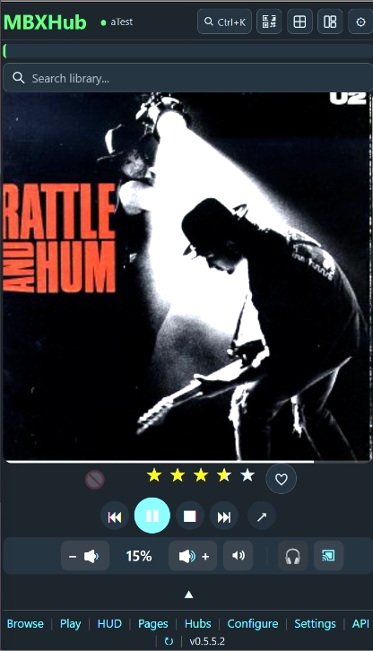 MBXHub dashboard v0.5.5.2 with the charm bar tucked away — the title bar with the hub dot, Ctrl+K search and the charm icons; the library search box; full-bleed album artwork; star rating and love; transport; the volume row at 15% with Listen Here and Cast; the page links in the footer